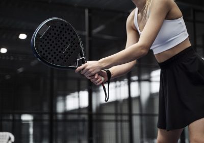 side-view-woman-playing-paddle-tennis